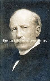 Corner of E. Fifth St and Brown in 1995 vs 2022