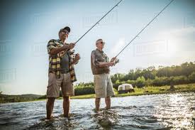 The best father and son fishing trips in scotland with professional, qualified guides. Caucasian Father And Son Fishing In River Stock Photo Dissolve