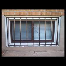 Iron windows arched windows windows and doors hacienda style homes spanish style homes steel stair railing fachada colonial window bars window grill design. Window Security Bars Gates And Grille