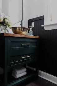 Coffee table with glass counter top in the middle of modern full of color living room with petrol blue armchair, powder pink. Modern Powder Room Reveal Crafted By The Hunts