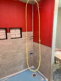 The first wall panel includes the corner piece and extends to the right (image 1). How To Easily Install Dumawall Diy Shower Tile Diy With Christine