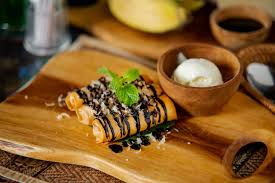This roll dessert recipe is quick to prepare and is the best sweet dish option that can be consumed after dinner. Banana Cheese Roll With Chocolate Picture Of White Yellow Restaurant Peliatan Tripadvisor