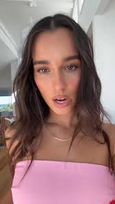 Our girl @demetra.dias styles our best-selling Vida White Bow Top 🤍🎀