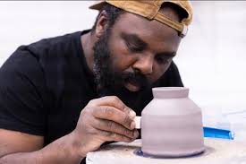 A collaborative installation by Omar Tate and Gregg Moore, ˈȯi-stər ·  ve-səl consists of 100 hand-thrown porcelain jars, hundreds of porcelain  oyster shells, a single large-scale water vessel, and a stoneware Thomas