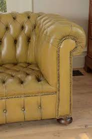 Enfield armchairs with leather swing arms. Chesterfield Sofa In Chartreuse Green Leather At 1stdibs