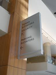 Interior Wayfinding Blade Sign Built And Installed By Dcl Dclbuilt Sign Wayfinding Blade Signage Signage Interior Signs