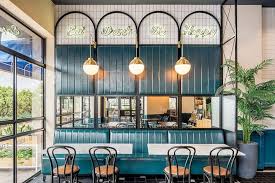 Hints Of Art Deco With Brass And Curves With Teal Upholstery And Gorgeous Neon Biga Cafe Interior Design Restaurant Interior Design Art Deco Interior Design