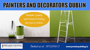 Blue paintbrush painting the white wall. Painters And Decorators Dublin