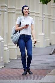 Mary Elizabeth Winstead wearing a white top and jeans with blue bonnet  while out in Soho,