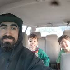 Should I continue to bait and hunt at a spot with hound hunters nearby?