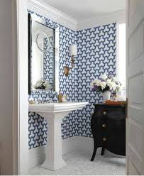 This minimal, rustic bathroom makes the best out of the least amount of decor possible, with a wooden ladder for the towels, a concrete floor, and open wood vanity. 29 Fabulous Wallpaper Ideas To Try For Your Powder Bathroom Part 1
