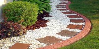 Pavers are used to define this garden bed filled with colorful flowers and tall grasses. What Is Rock Gardening Why Is It Popular Mile High Gardening