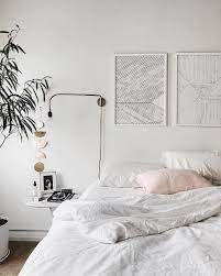 Prediction These 6 All White Bedroom Ideas Will Make Minimalists Swoon Hunker All White Bedroom Minimalist Bedroom Design Simple Bedroom