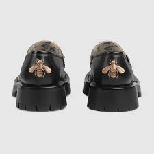 A lug sole horsebit loafer with blue rosebud print lining on the insole. Black Leather Lug Sole Horsebit Loafer Gucci Bg
