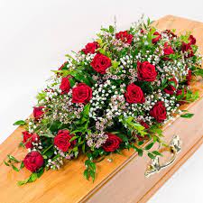 The beauty and elegance of this sympathy casket spray will be sure to celebrate the life of the deceased and help soothe the bereaved family of their tragic loss. Rose And Gypsophila Casket Spray Floral Roundabout Worcester Worcestershire