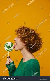 Middle-aged Ginger Smiling Woman Liking Lollipop Stock Photo 2234483105 |  Shutterstock