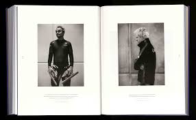 ONE BY ONE, THE SKATERS GLIDE INTO THEIR STARTING POSITIONS, SHAKING THE  LAST JITTERS FROM THEIR POWERFUL LEGS AS THE ANNOUNCER