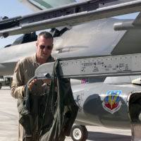 Senior Airman Kendra Drew marshals a KC-135 Stratotanker