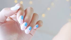 American flag nail painting with brush. 13 Memorial Day Nail Art Ideas Stylecaster