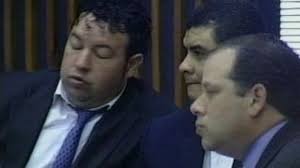 Who is that man who whispers into Albarran's ear?