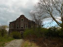 Vincennes Hall showing L-shaped red brick building with deterioration