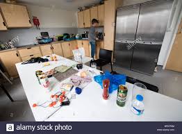 dirty messy student shared kitchen with