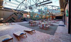 Located In Oklahoma City The Jones Assembly Is A 20 000 Square Foot Music Venue Restaurant And Bar In The Redesigne Building Exterior Restaurant Design Patio