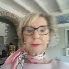 My grandma, known as Minnie Forth is at the front of the picture next to  the gentleman. She is the taller lady. The picture is all the Woolworths  staff. Not sure on