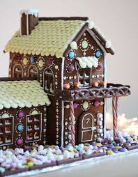 Cut christmas tree shapes and gingerbread men out of remaining dough. I Love The Chocolate Dipped Pretzel Porch Railing On This Two Story Gingerbread House Gingerbread House Cookies Gingerbread House Patterns Gingerbread House