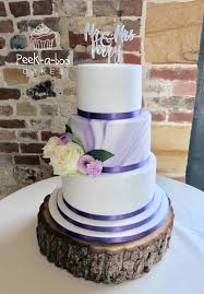Pretty lilac flowers on white wedding cake . Wedding Cakes Www Peek A Boocakes Co Uk