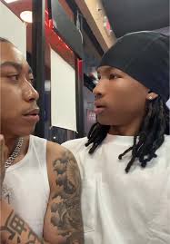 Fendi Buh and Damien Kissing