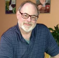 Class of 2003 graduate reads original poem at ceremony