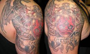 A tattoo is a permanent change to your appearance and can only be removed by surgical means or laser treatment, which can be disfiguring, costly and/or painful. Beautiful Colorful Family Crest With Dragon Tattoo On Half Sleeve Tattooimages Biz
