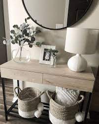 The mixed material design of this console table makes it a coastal farmhouse accent in your entryway or living room. 30 Fantastic Entryway Console Tables Design Ideas To Try Asap Hallway Table Decor Entryway Console Table Living Room Decor Apartment