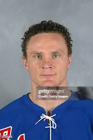 Tom Poti of the New York Rangers poses for a portrait