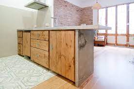 Concrete And Wood Cupboard Doors And Shelves Concrete Kitchen Plywood Kitchen Rustic Kitchen