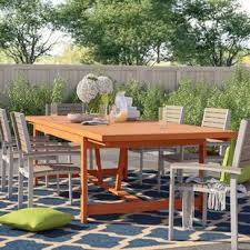 Outdoor dining table and chairs with umbrella hole. Farmhouse Rustic Umbrella Hole Outdoor Dining Tables Birch Lane