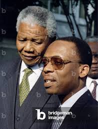 Image of South African President Nelson Mandela (L) and exiled Haitian  President