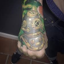 New School Diving Helmet Tattoo On The Right Hand
