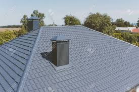 We specialise in roof replacement, gutter replacement and gutter guards. Modern Roof Made Of Metal Gray Blue Metal Roof Tiles On The Stock Photo Picture And Royalty Free Image Image 137538728