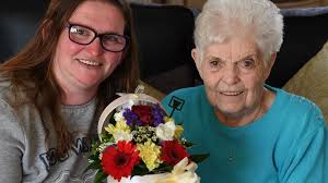 Grateful Wishaw mum says it with flowers to retiring lollipop lady