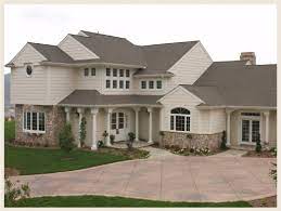Behr makes interior and exterior paints and primers, wood stains, finishes, strippers, cleaners, floor coatings, sealants and specialty products like stucco and roof paints. Tan Home Brown Shingles Colorfully Behr