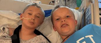 11-year-old boy hit while riding scooter out of coma