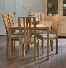 Madison dining table with 4 melbourne chairs, medallion yellow, largeby shankar uk llp. Ercol Bosco Oak Extending Dining Table And Cream Chairs Cfs Furniture Uk