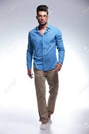 Select from premium walking towards camera isolated of the highest quality. Full Length Picture Of Casual Young Man Walking Towards The Camera Stock Photo Picture And Royalty Free Image Image 21464610