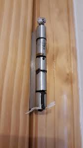 Open the door to find hinges and use a drill or screwdriver to remove the screws fastening the door. Door Hinge Filled With A Tar Like Black Substance How Might I Clean It Out Fixit