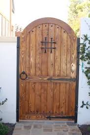 Dw1 this gate is made with heated solid steel that has been shaped and hammered in our forge. I Need To Find An Old Door For A Gate To My Yard I Would Love If It Had A Window In It But Love The Curved Top Patio Gates Garden