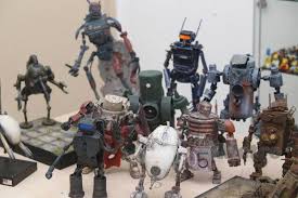 Tapi kali ini sticknya nggak masuk ke dalam botol tapi berdiri di bekas kotak susu. Robot Diy