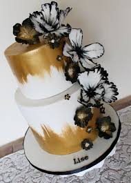 Birthday cakes are made from either vanilla or flavoured sponge with a flavoured icings by sugar and crumbs. Gold And White And Black Elegant Modern Sugar Flower Cake With Painted Gold On White Modern Birthday Cakes Elegant Birthday Cakes 60th Birthday Cakes