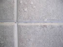 Most grout used in tile floors is porous and can become dirty over time. How Do I Repair Cracked Grout On Shower Walls Shower Grout Shower Wall Cleaning Shower Tiles